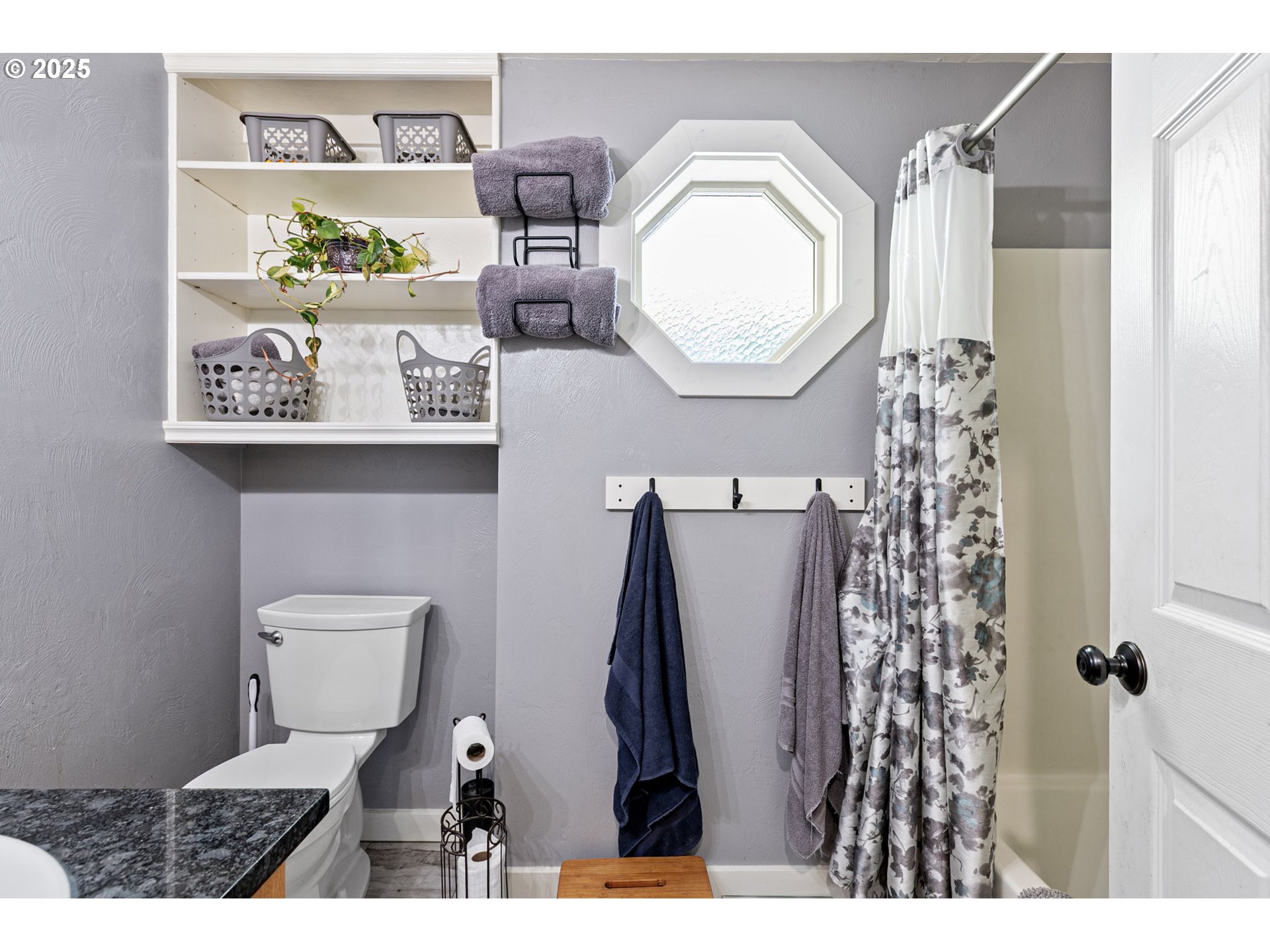 1011 Rose Street Junction City, OR 97448 - Photo 35 of 44 a bathroom with a toilet a sink and a mirror