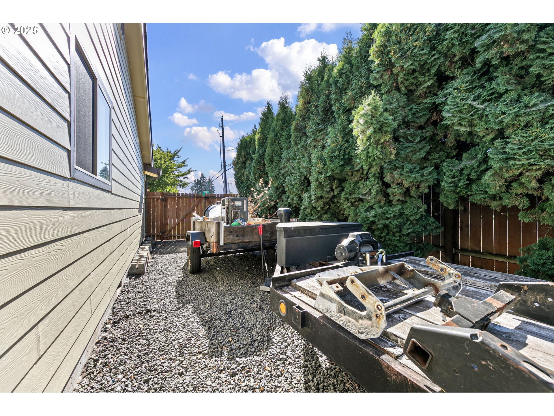 1011 Rose Street Junction City, OR 97448 - Photo 44 of 44 a view of a patio with table and chairs with wooden floor and fence