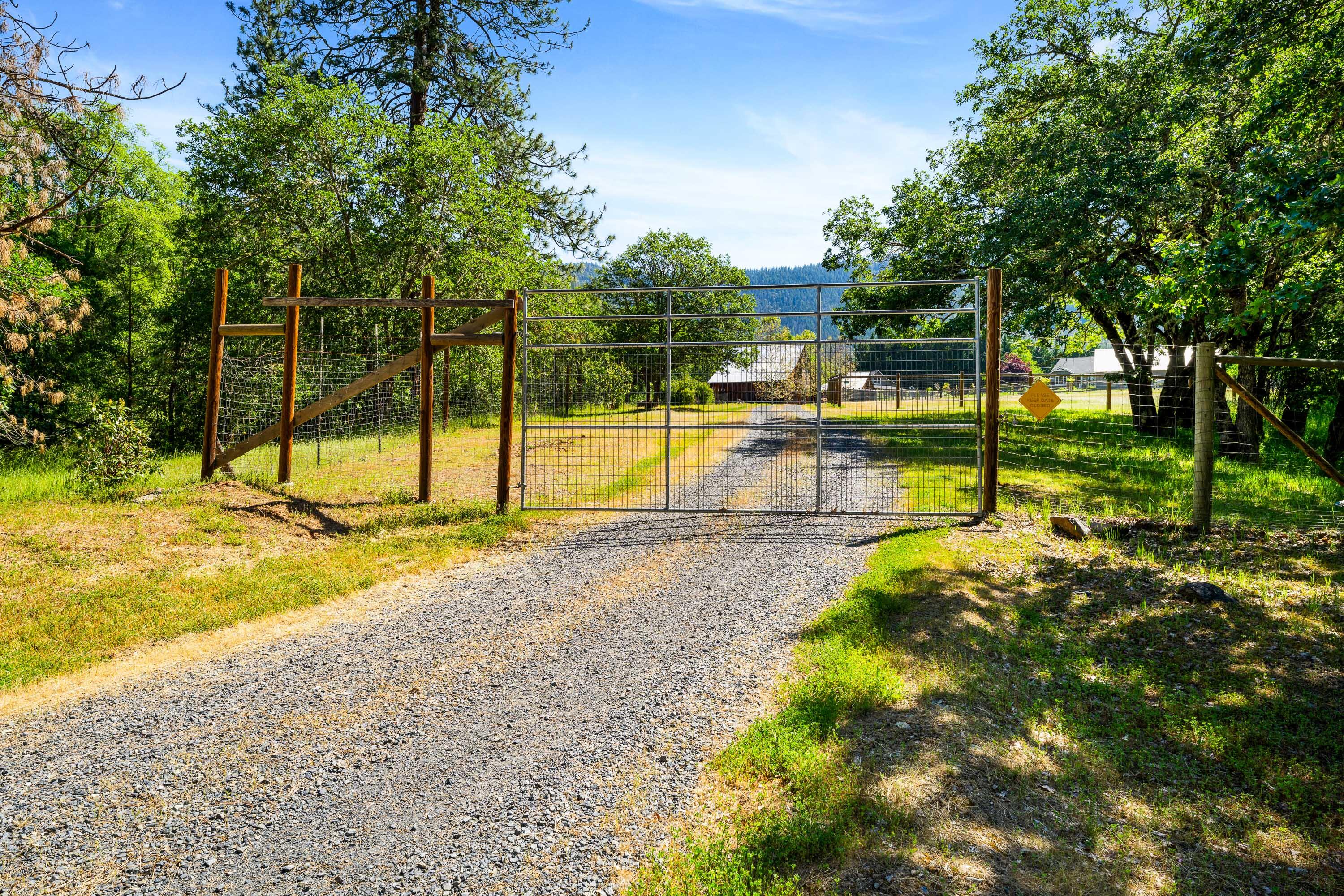 931 Hogan Road Jacksonville, OR 97530 - Photo 11 of 74 a view of a swimming pool with a yard