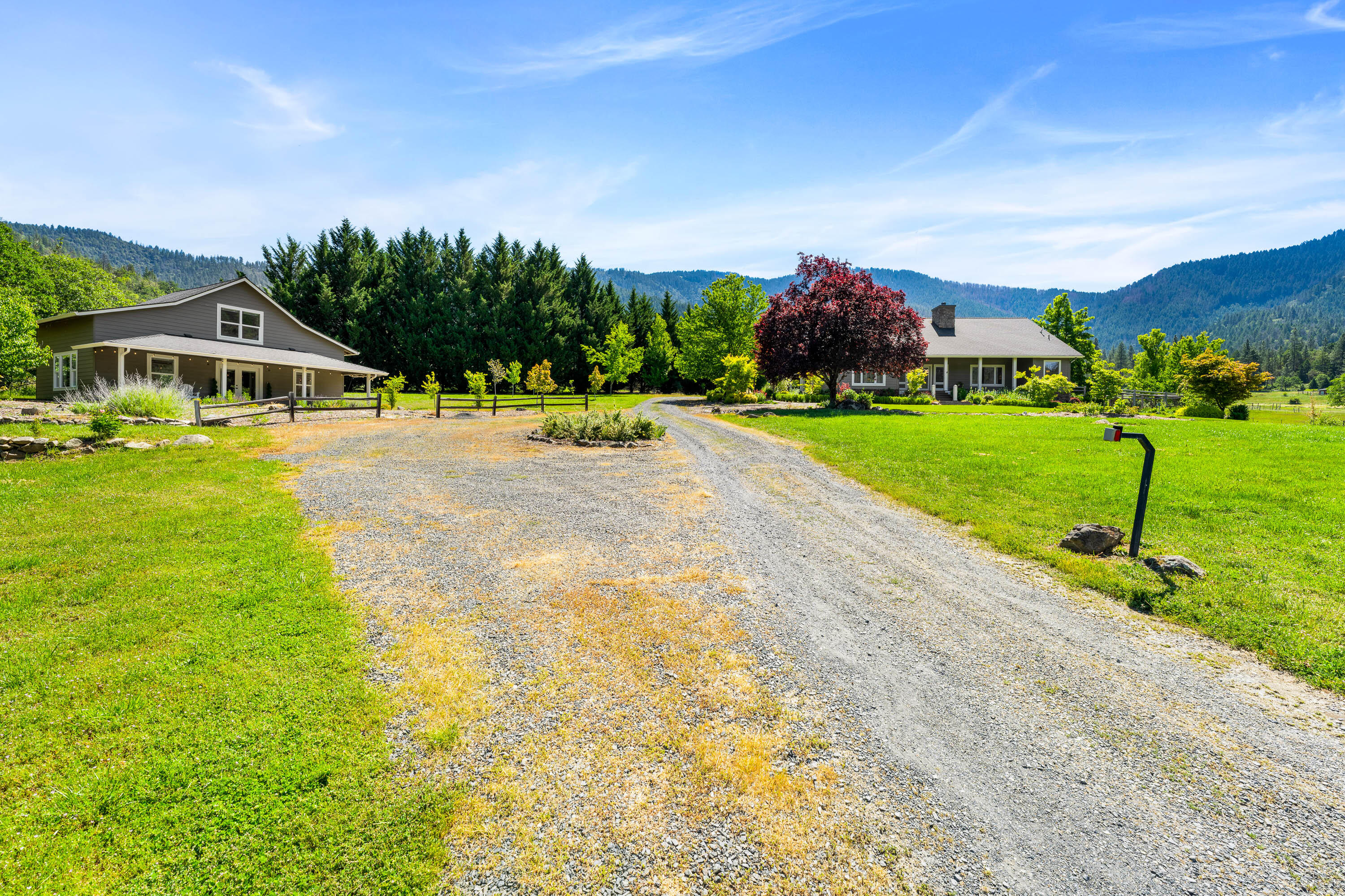 931 Hogan Road Jacksonville, OR 97530 - Photo 16 of 74 a front view of a house with garden