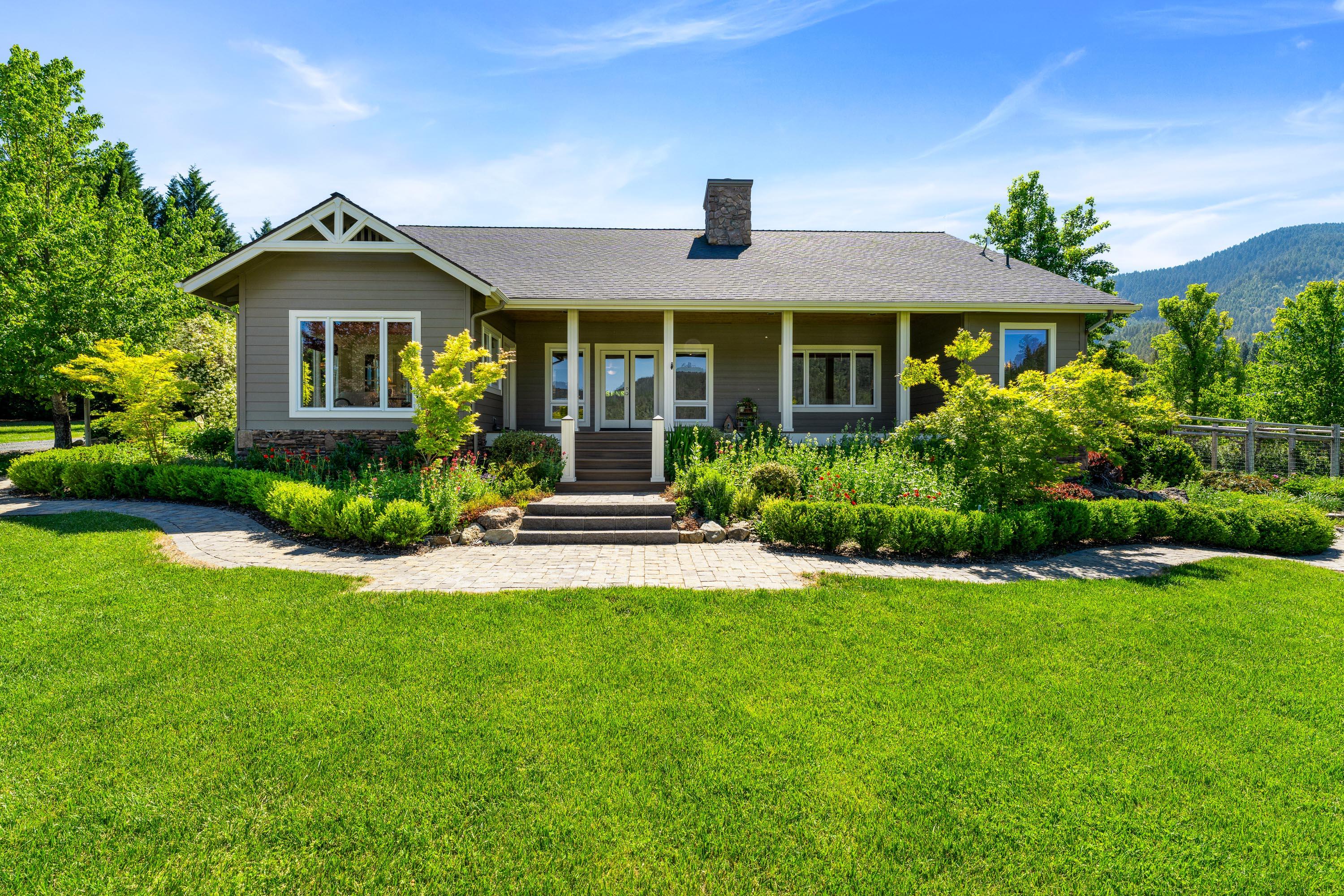 931 Hogan Road Jacksonville, OR 97530 - Photo 18 of 74 a front view of a house with a yard
