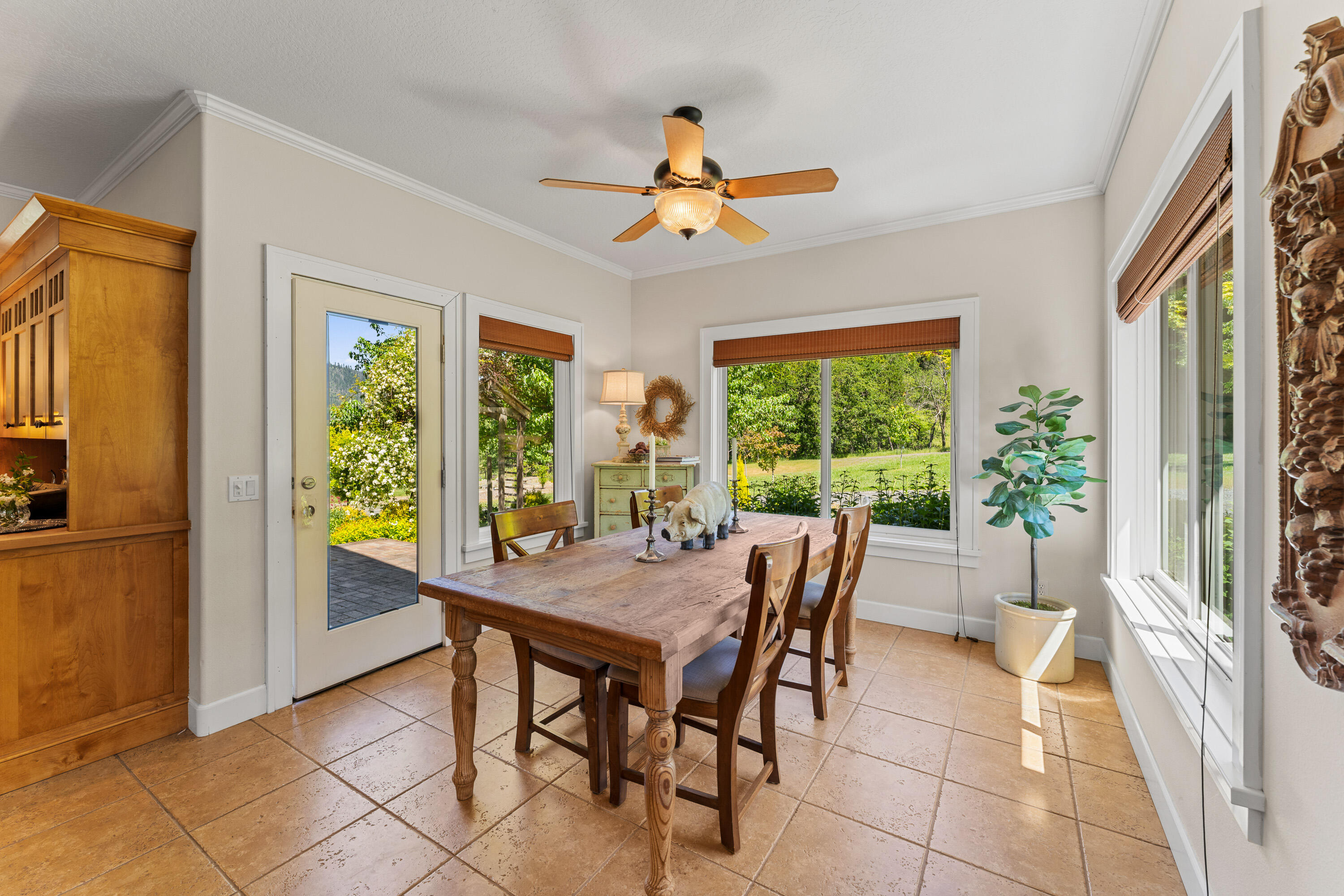 931 Hogan Road Jacksonville, OR 97530 - Photo 53 of 74 a view of a dining room with furniture window and outside view