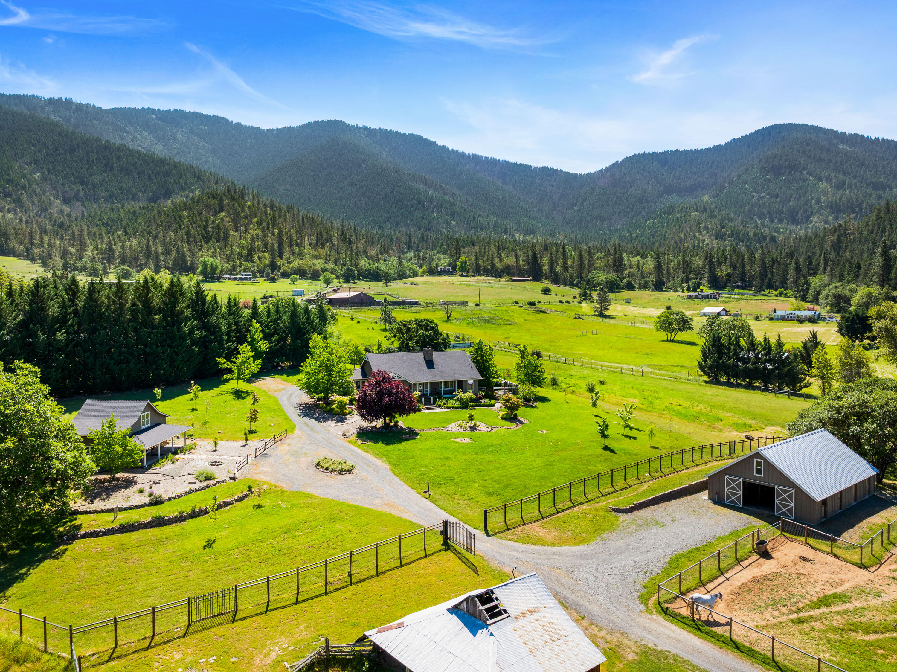 931 Hogan Road Jacksonville, OR 97530 - Photo 8 of 74 a view of a swimming pool with a patio and mountain view