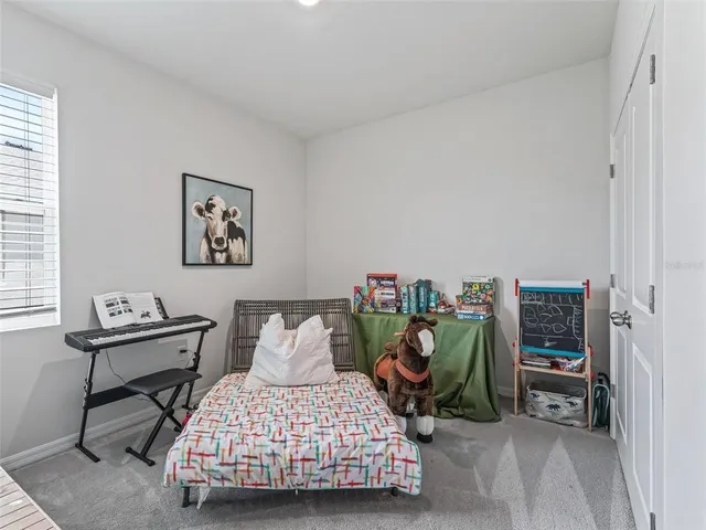 a bedroom with furniture and a bed