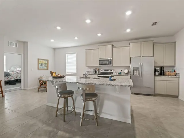 a kitchen with counter top space cabinets and stainless steel appliances