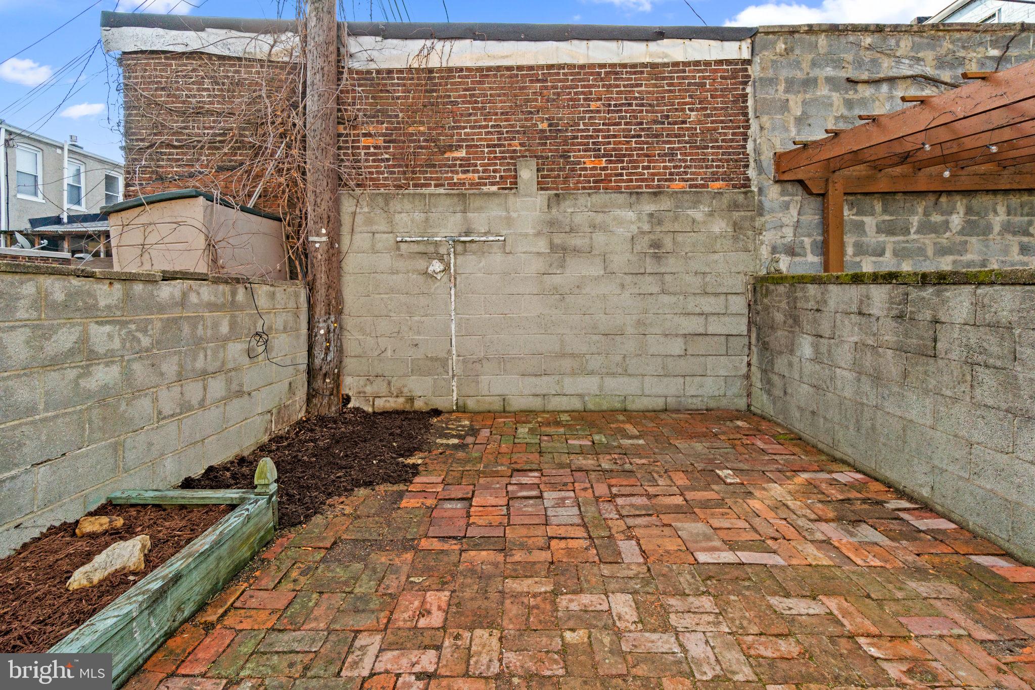 1827 Bank Street Baltimore, MD 21231 - Photo 27 of 31 Charming brick patio for outdoor gatherings.