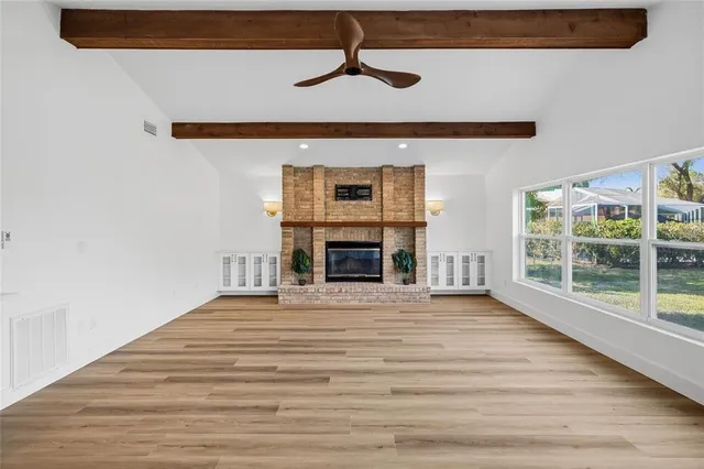 a bathroom with a double vanity sink a large mirror a shower and bathtub