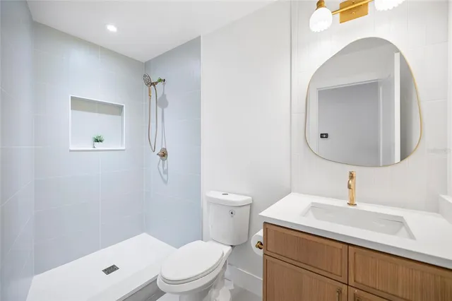 a view of a closet area with an empty room