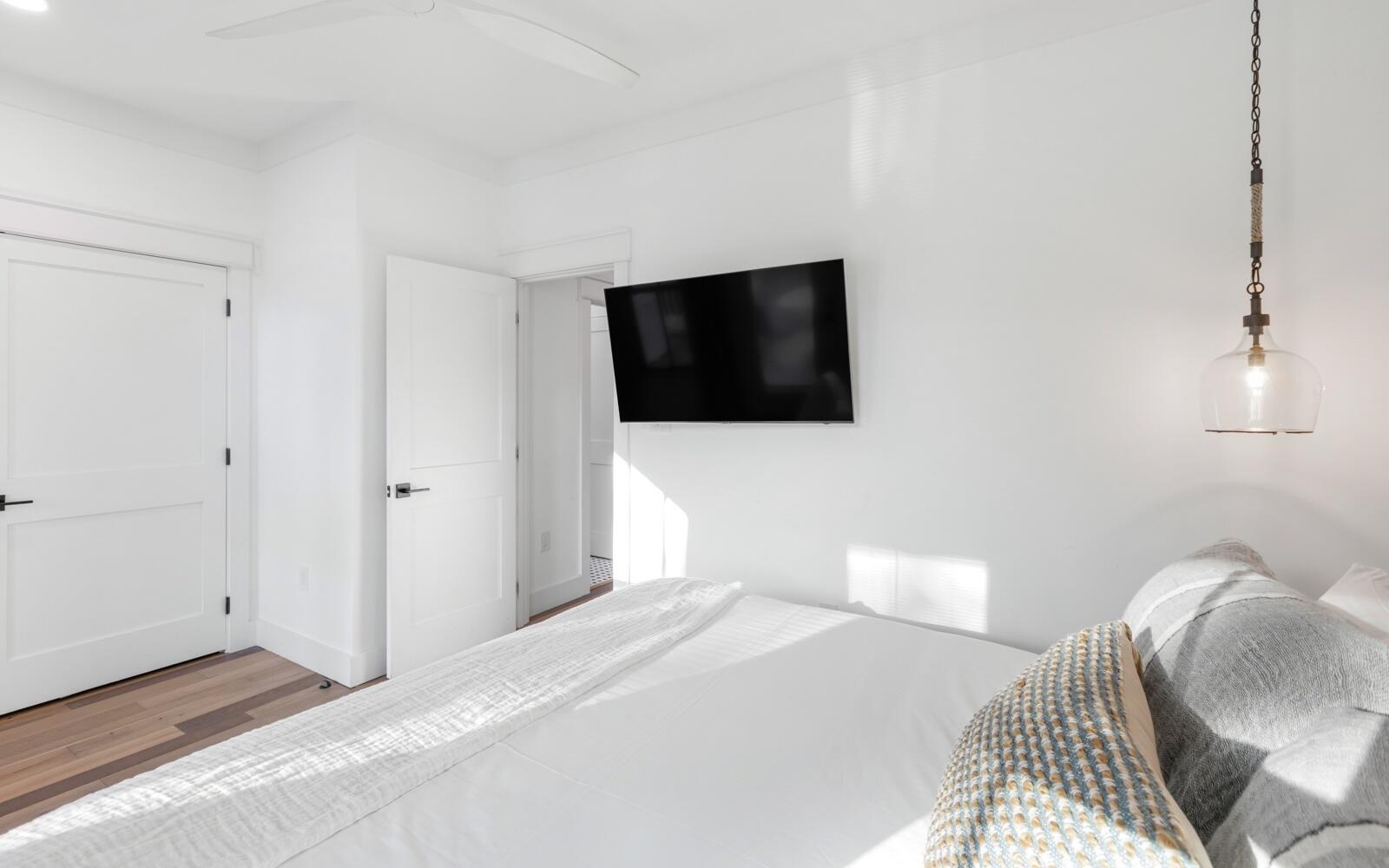 111 Crescent Road Santa Rosa Beach, FL 32459 - Photo 36 of 70 a bedroom with a bed and a flat screen tv