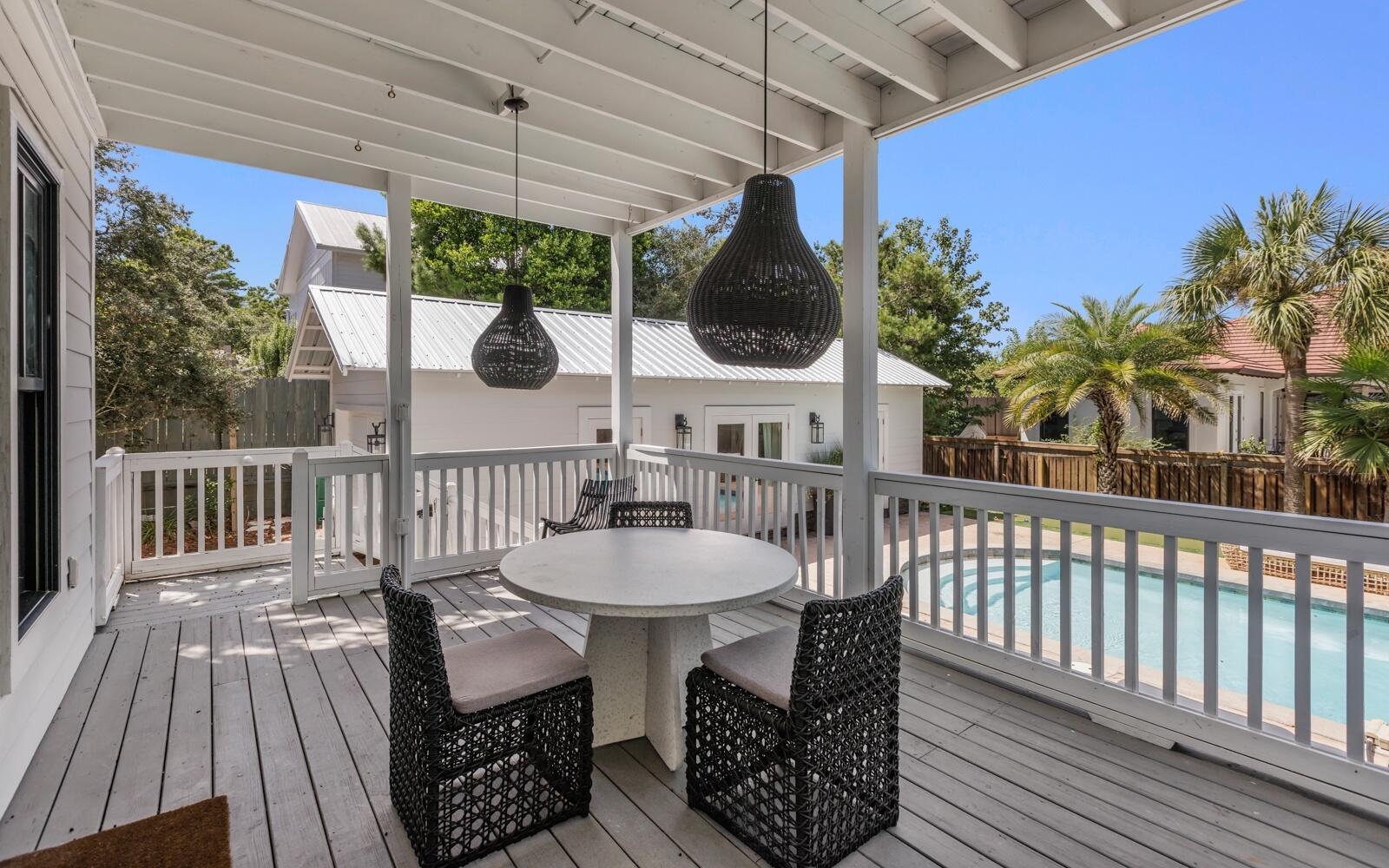 111 Crescent Road Santa Rosa Beach, FL 32459 - Photo 5 of 70 a view of a chairs and table in patio