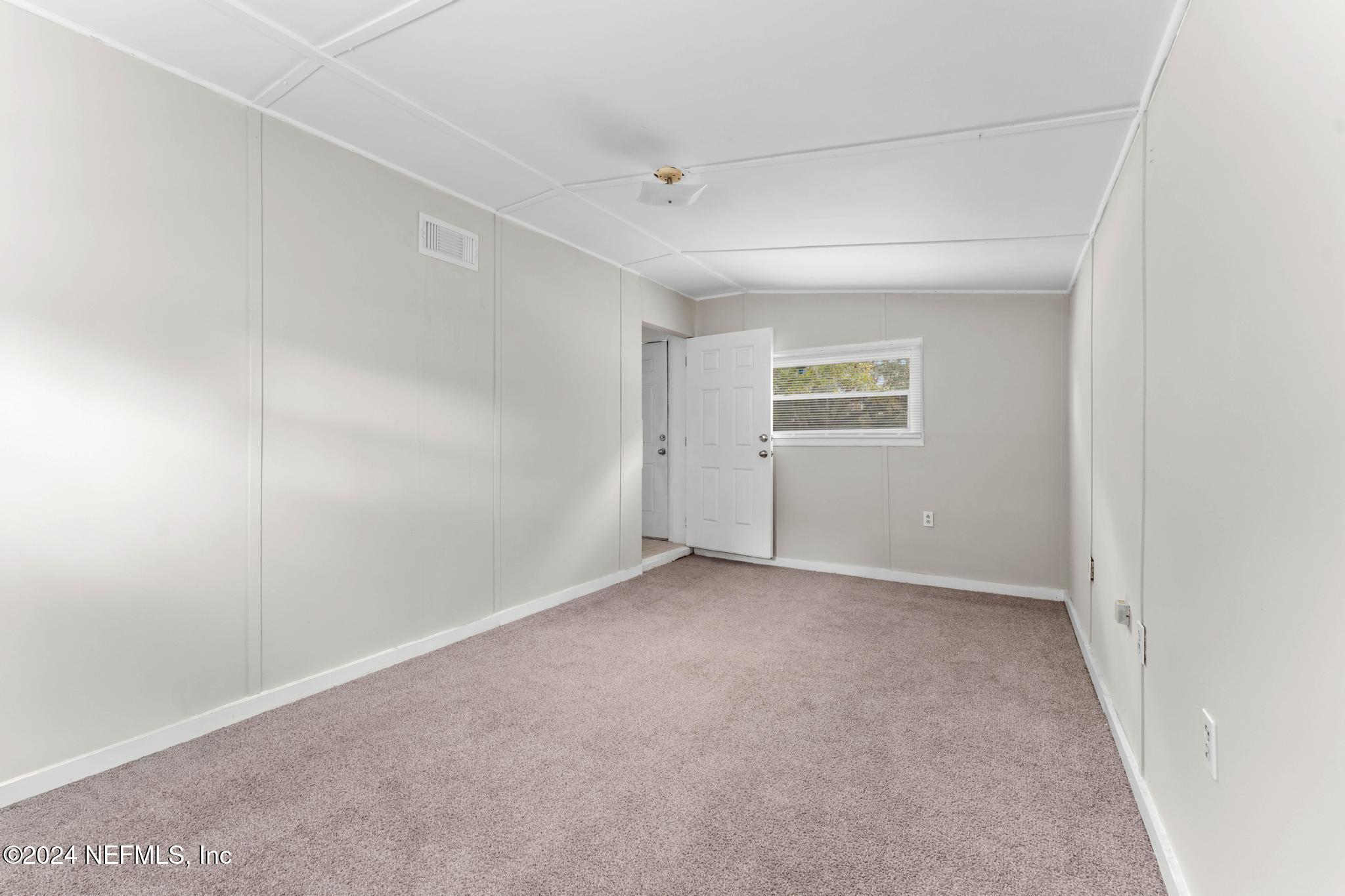 325 Toccoa Road Orange Park, FL 32073 - Photo 15 of 19 a view of an empty room with a window