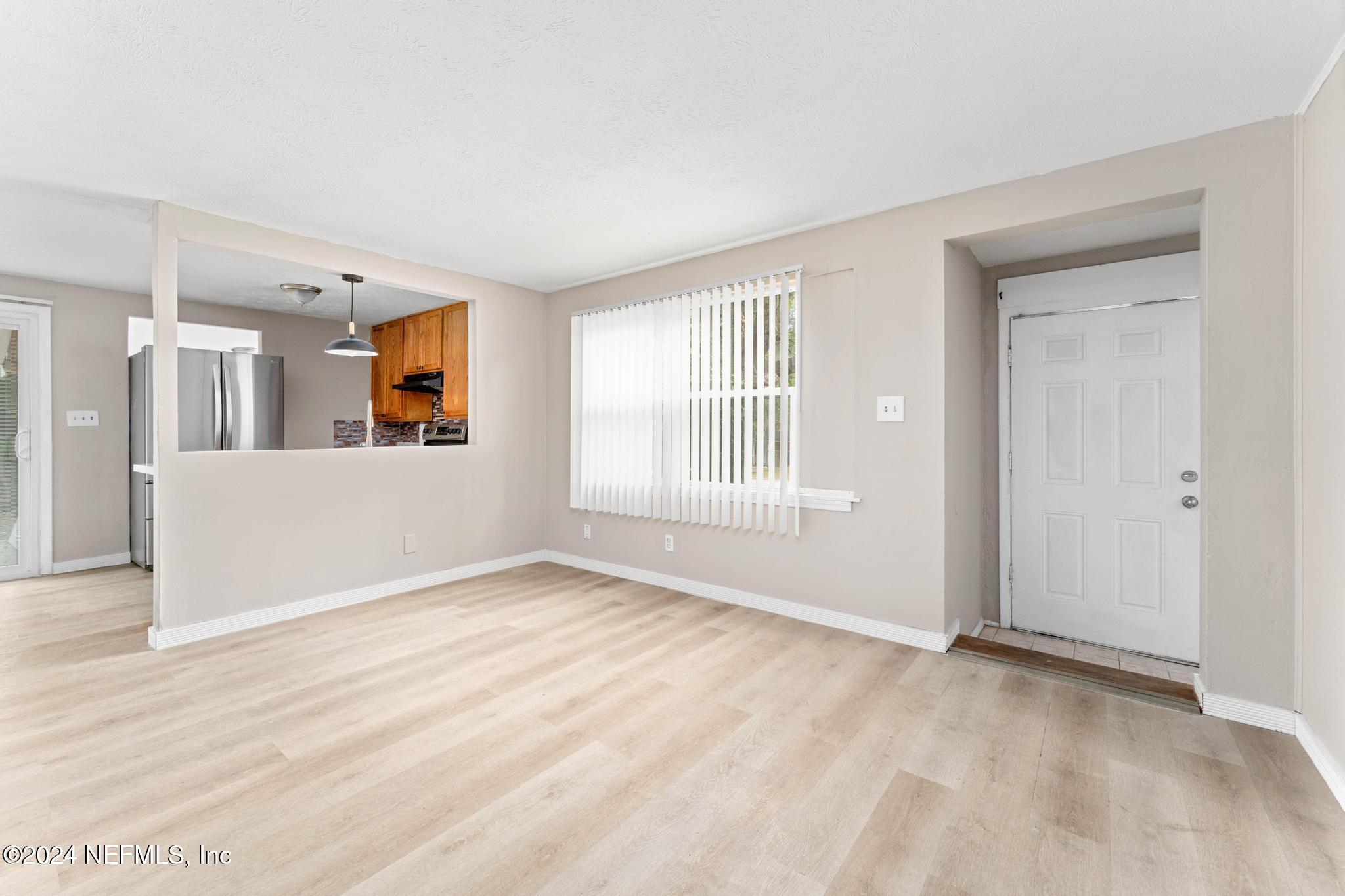 325 Toccoa Road Orange Park, FL 32073 - Photo 4 of 19 a view of a big room with windows and cabinet