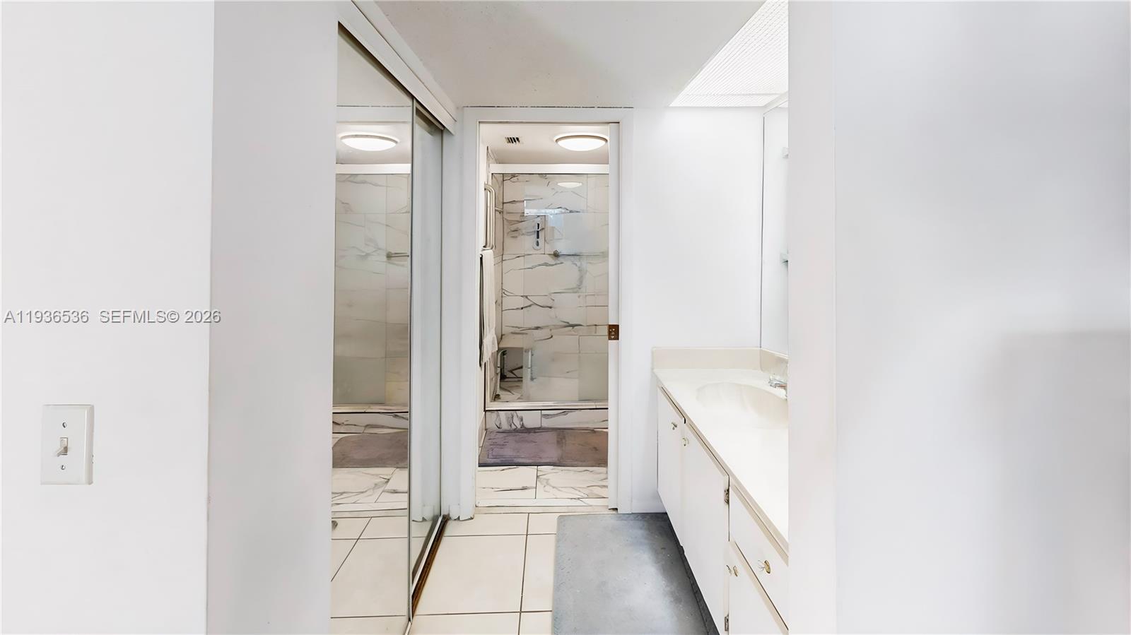 2657 Southeast 19th Court, Unit 103E Homestead, FL 33035 - Photo 18 of 50 a bathroom with a bathtub and a shower