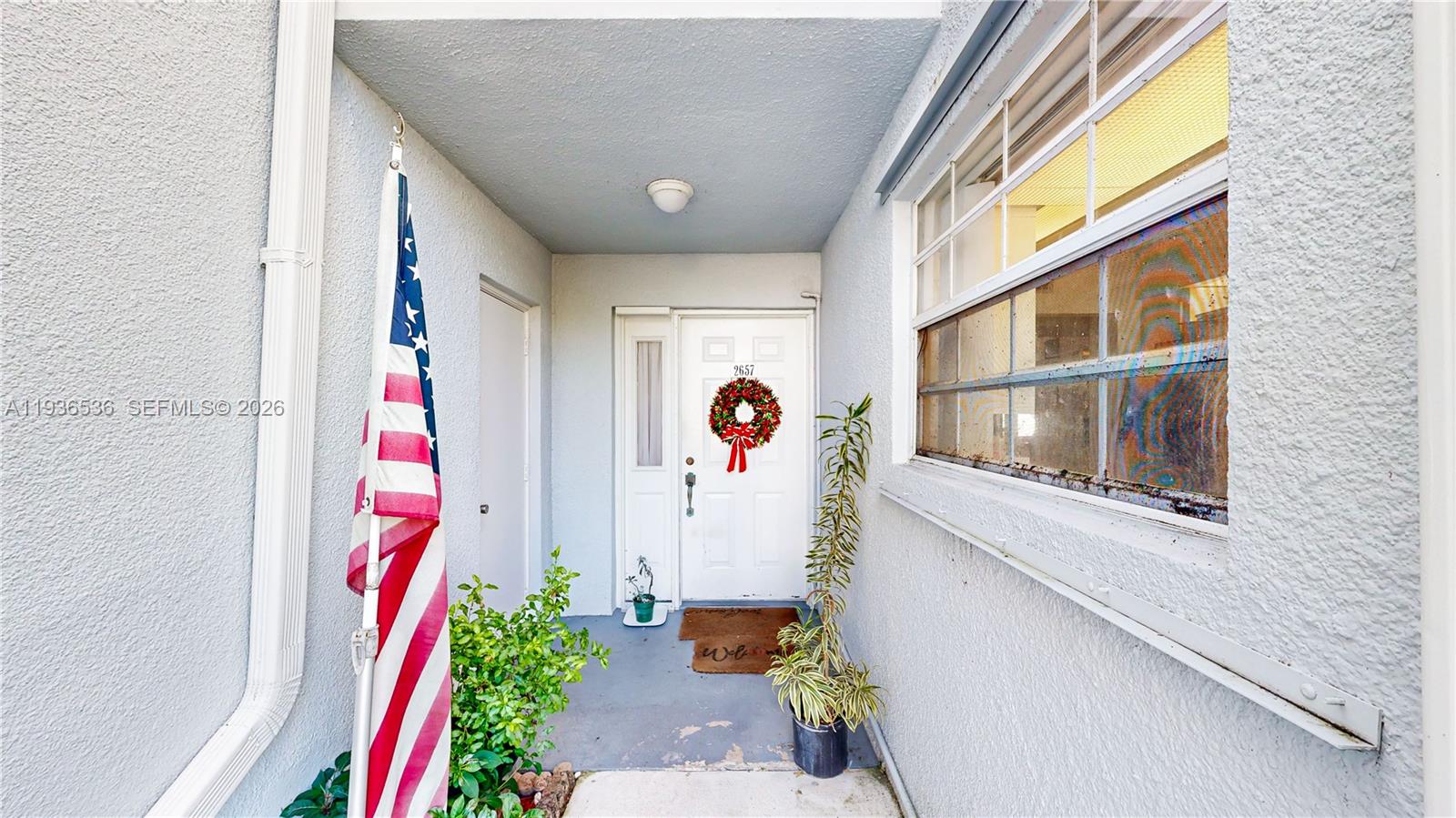 2657 Southeast 19th Court, Unit 103E Homestead, FL 33035 - Photo 3 of 50 a view of front door of house