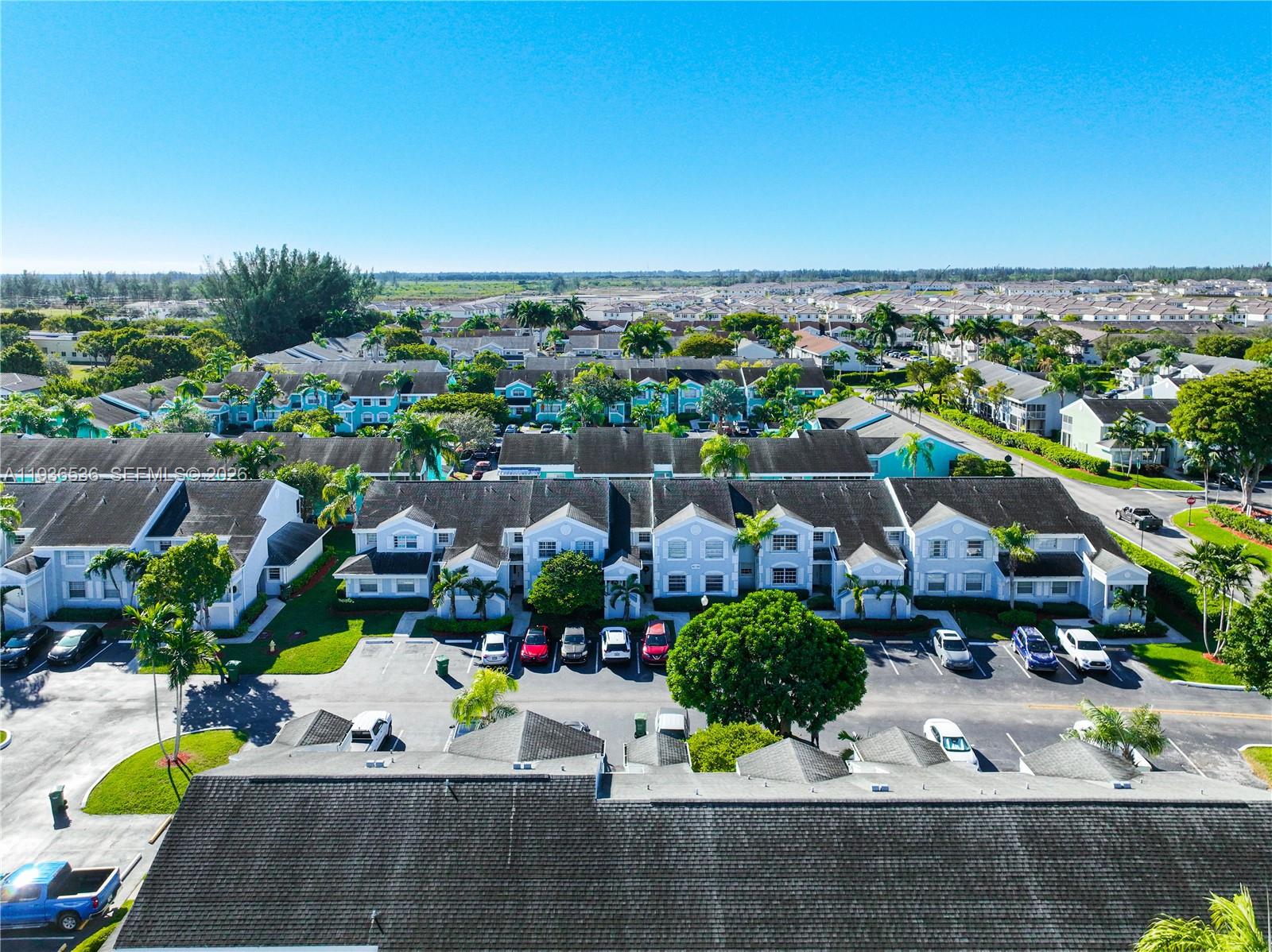 2657 Southeast 19th Court, Unit 103E Homestead, FL 33035 - Photo 32 of 50 an aerial view of multiple house