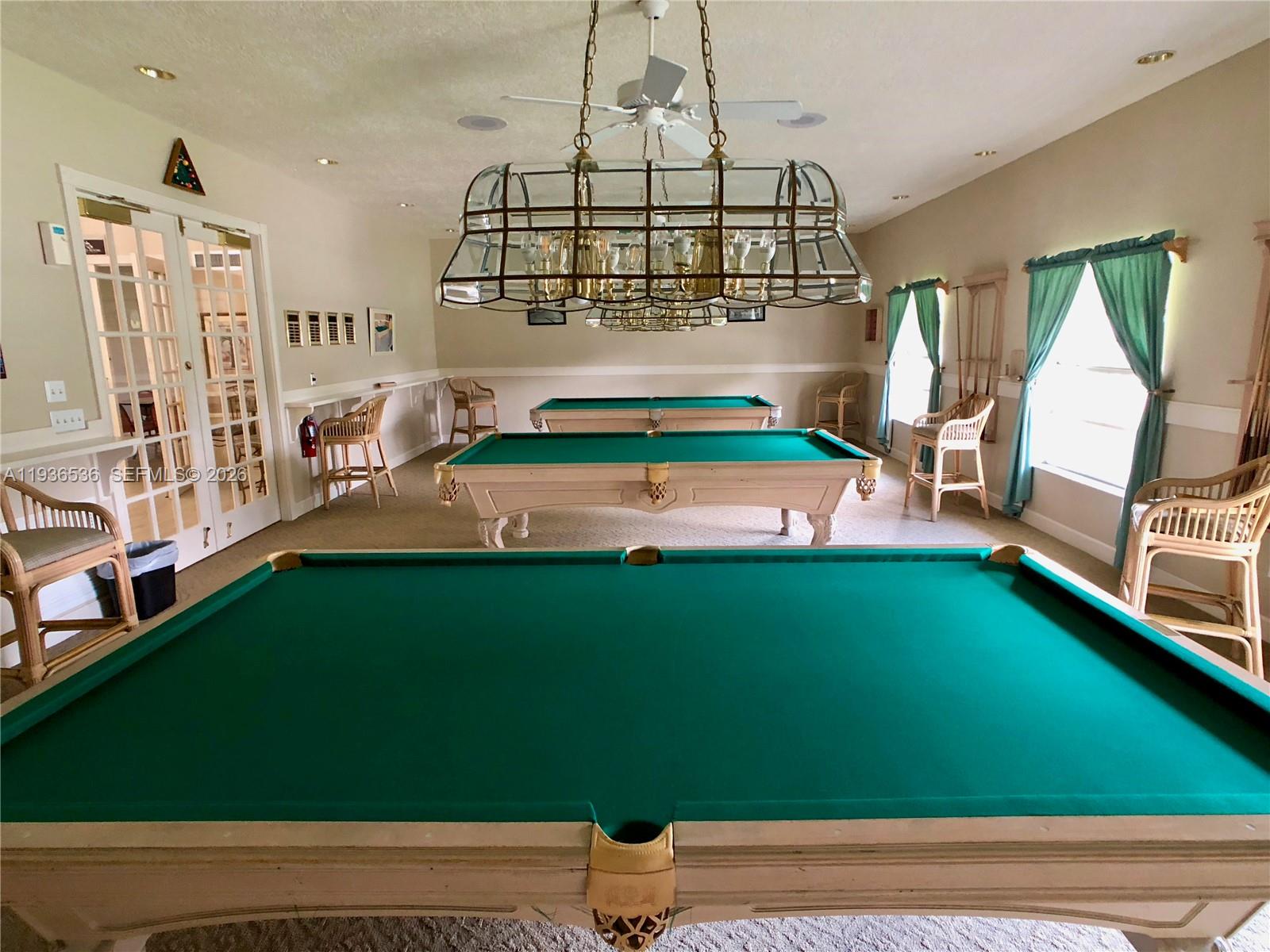 2657 Southeast 19th Court, Unit 103E Homestead, FL 33035 - Photo 36 of 50 a room with pool table and windows