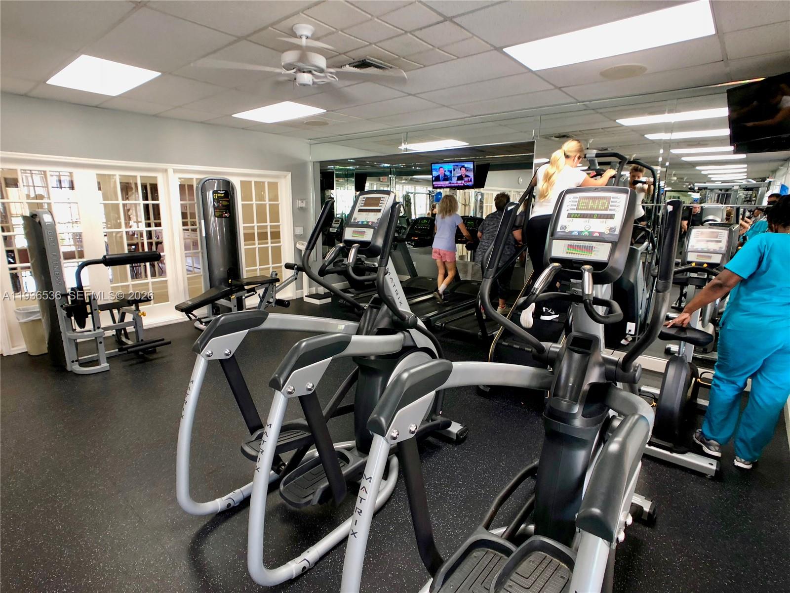 2657 Southeast 19th Court, Unit 103E Homestead, FL 33035 - Photo 37 of 50 a view of a room with gym equipment
