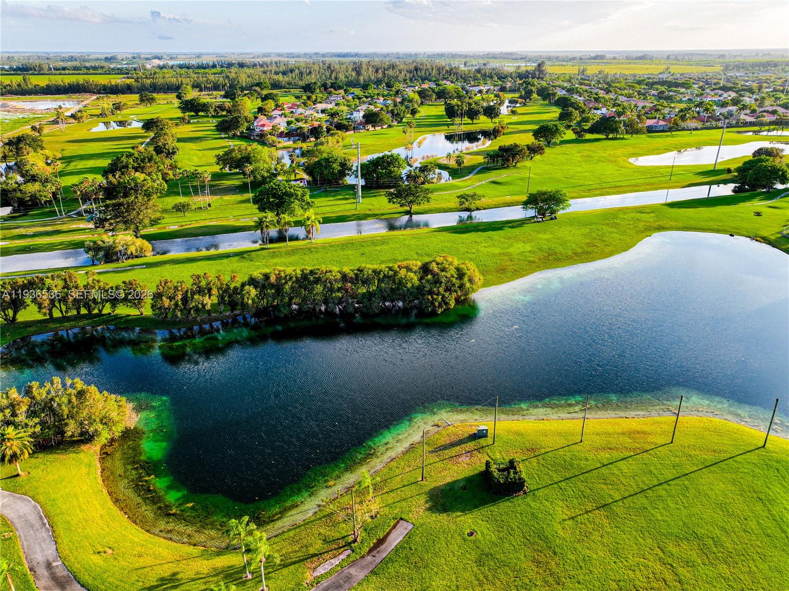 2657 Southeast 19th Court, Unit 103E Homestead, FL 33035 - Photo 45 of 50 a view of an outdoor space pool patio and lake view