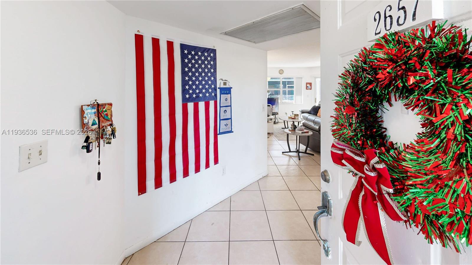2657 Southeast 19th Court, Unit 103E Homestead, FL 33035 - Photo 5 of 50 a view of a bedroom with a potted plant