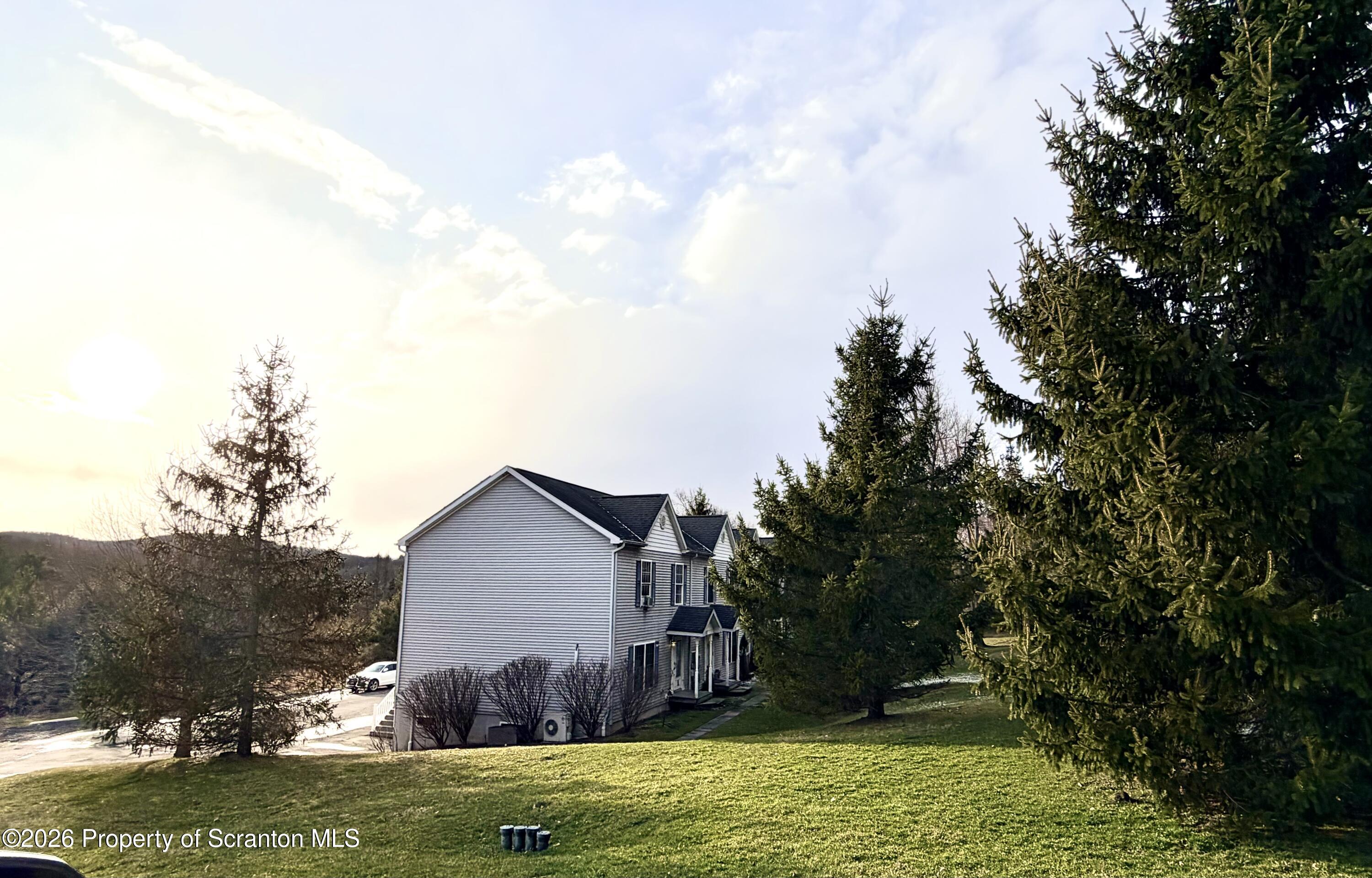 41 South Waterford Road Dalton, PA 18414 - Photo 2 of 22 a view of a backyard with large trees