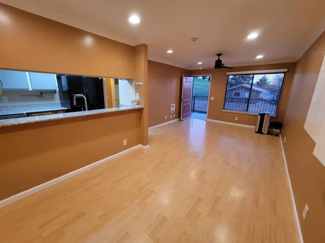 a view of an empty room with a window