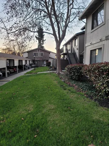 a view of balcony with a potted plants