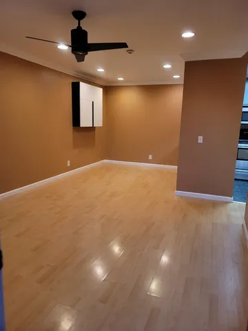 a view of a big room with windows