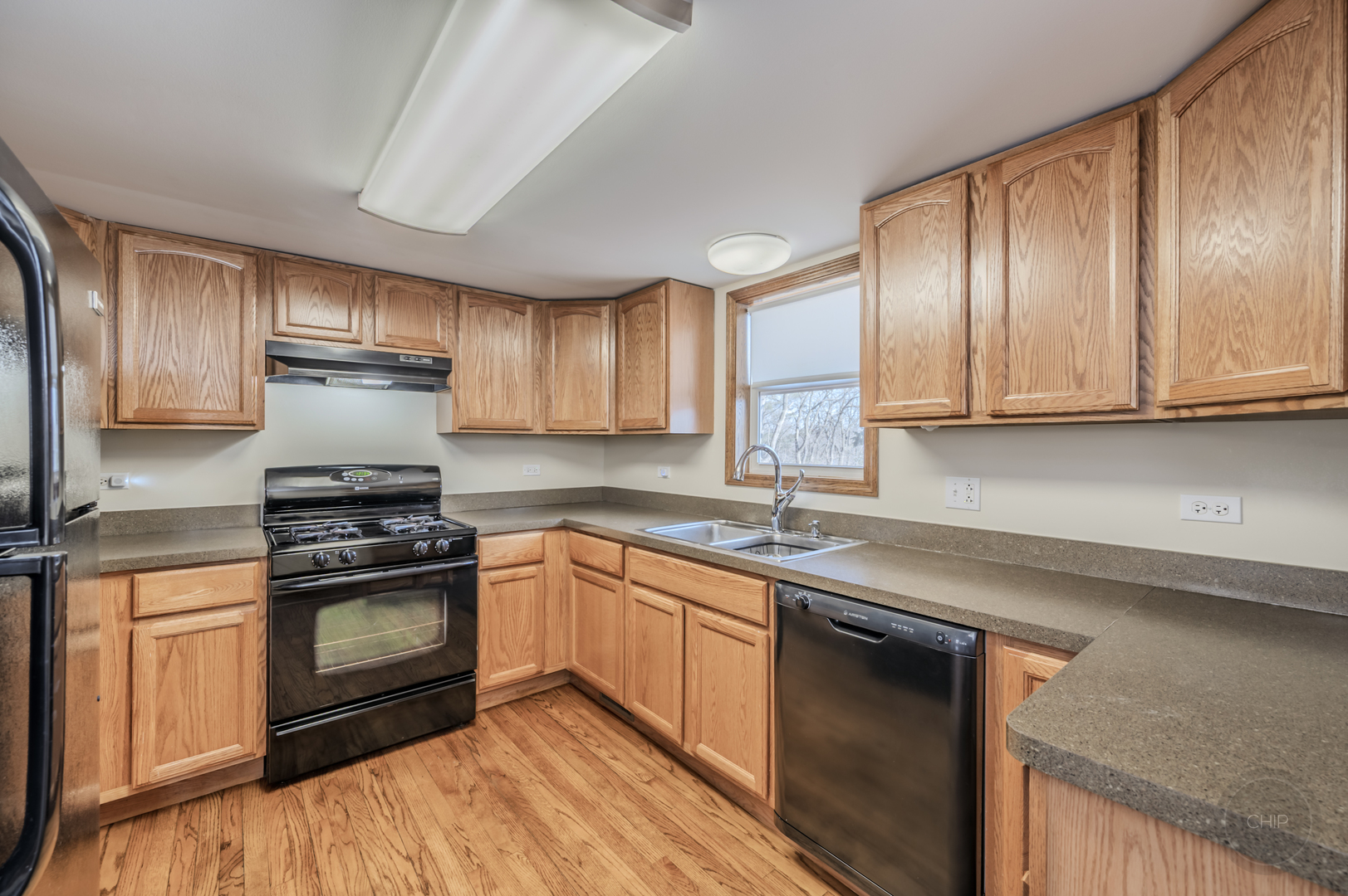 2240 State Rte 31 Oswego, IL 60543 - Photo 14 of 54 a kitchen with stainless steel appliances granite countertop a stove a sink and a microwave