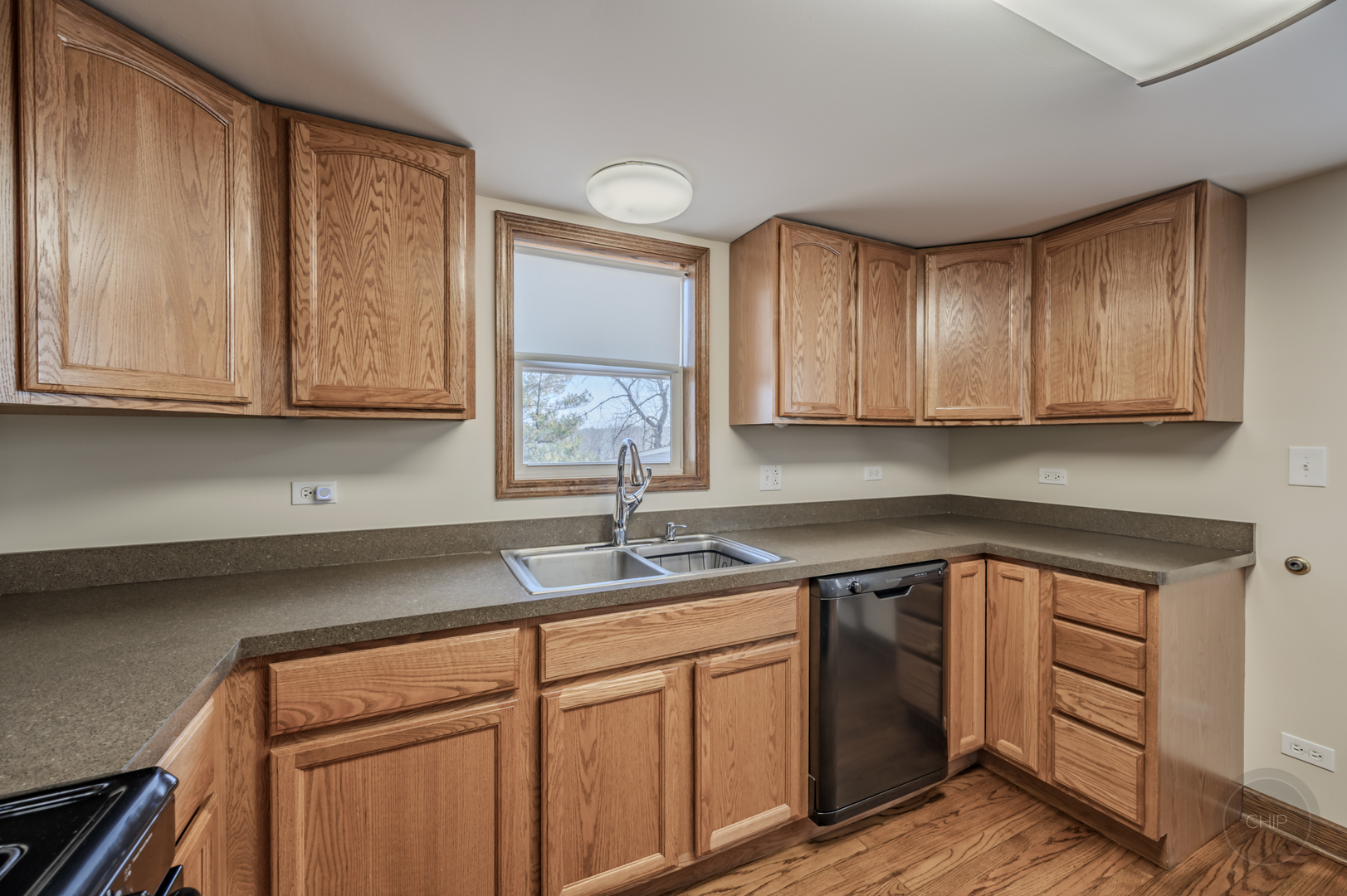 2240 State Rte 31 Oswego, IL 60543 - Photo 15 of 54 a kitchen with stainless steel appliances granite countertop a sink dishwasher stove and cabinets