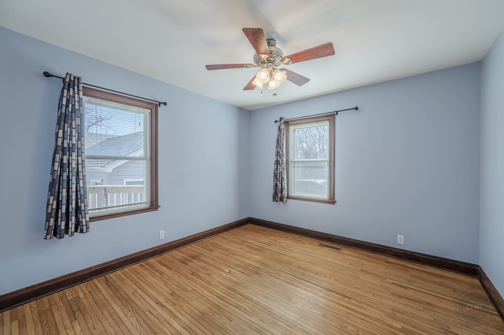 2240 State Rte 31 Oswego, IL 60543 - Photo 20 of 54 a view of an empty room with wooden floor and a window
