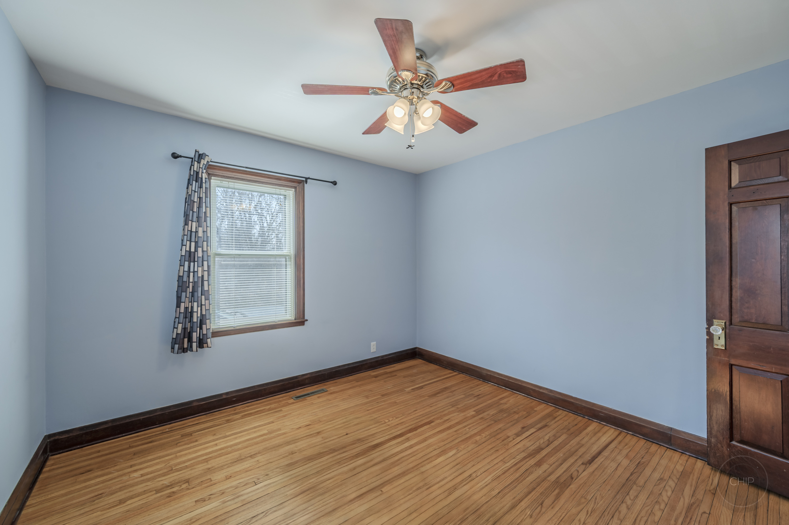 2240 State Rte 31 Oswego, IL 60543 - Photo 22 of 54 an empty room with wooden floor chandelier fan and windows