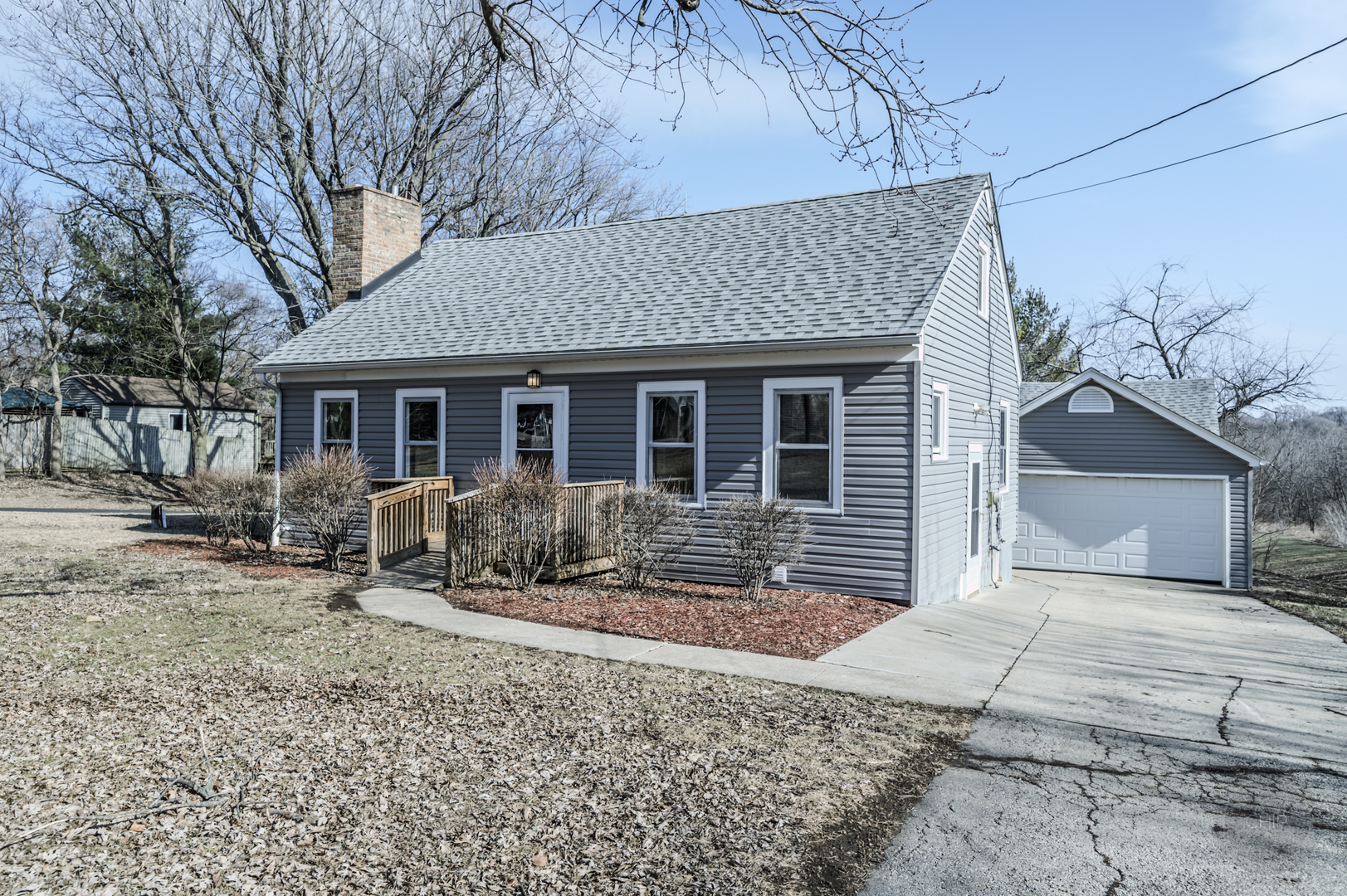 2240 State Rte 31 Oswego, IL 60543 - Photo 3 of 54 a front view of a house with yard and seating area