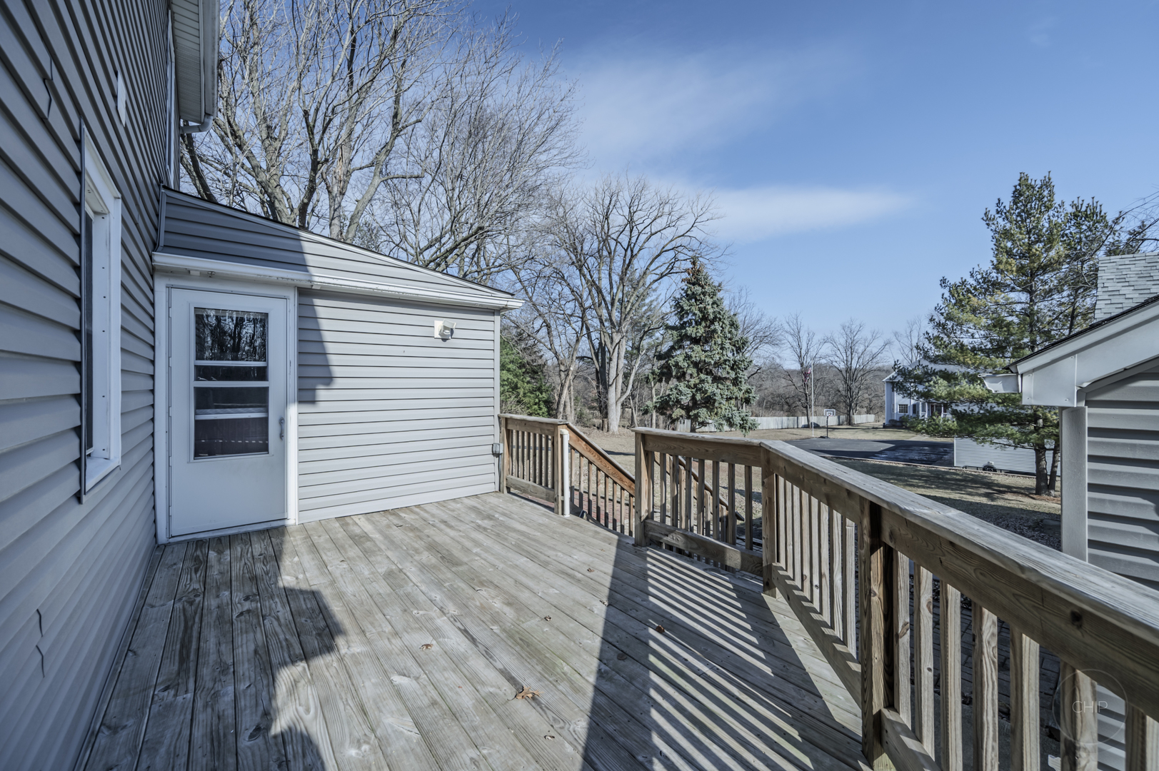 2240 State Rte 31 Oswego, IL 60543 - Photo 39 of 54 a view of a balcony with wooden floor and fence