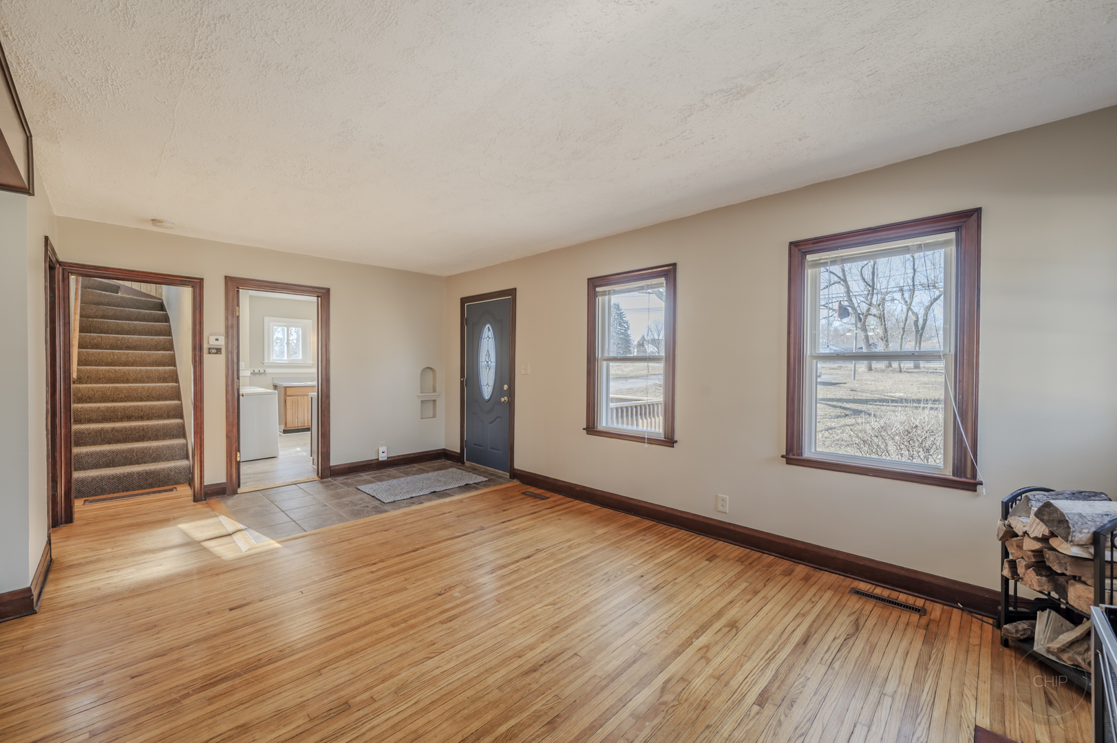 2240 State Rte 31 Oswego, IL 60543 - Photo 5 of 54 a view of an empty room with a window and wooden floor