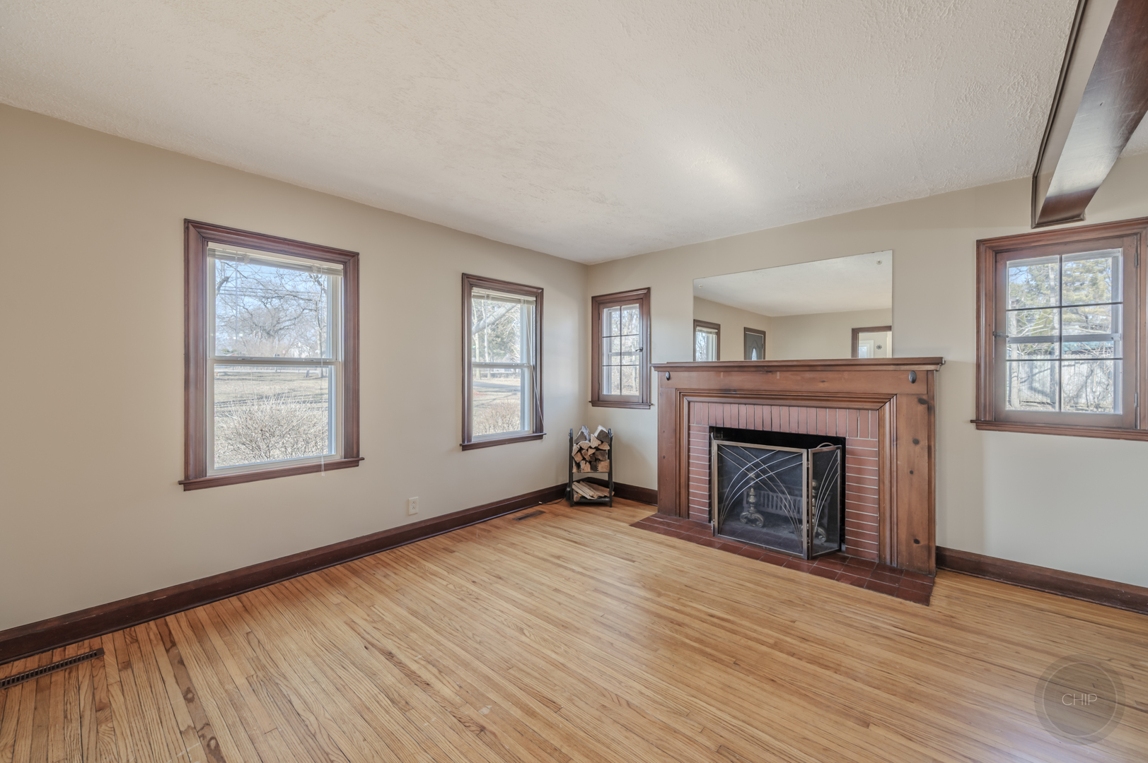 2240 State Rte 31 Oswego, IL 60543 - Photo 8 of 54 a view of an empty room with wooden floor fireplace and a window