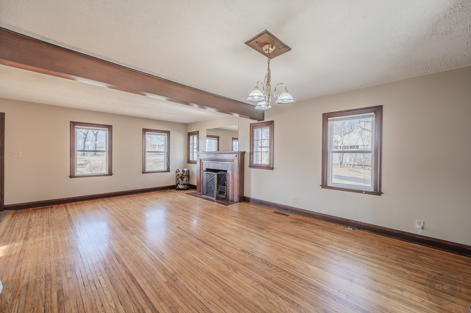 2240 State Rte 31 Oswego, IL 60543 - Photo 9 of 54 a view of an empty room with wooden floor and windows