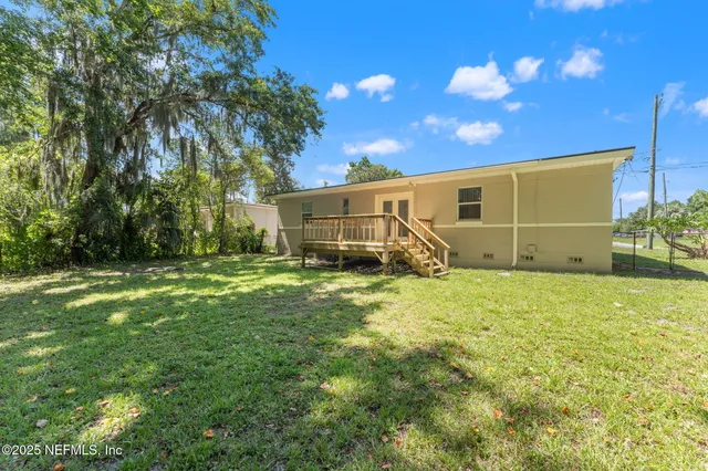 a backyard of a house with lots of green space