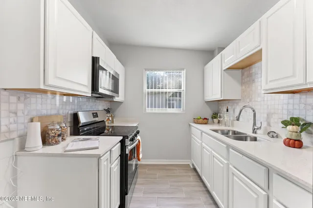 a kitchen with a stove and a microwave