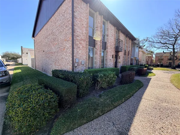 a view of a building with a yard