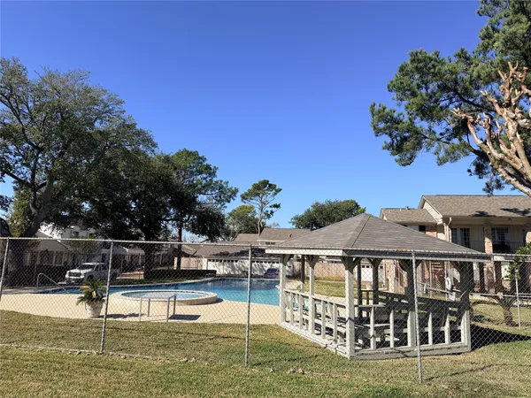 a view of a swimming pool with a patio