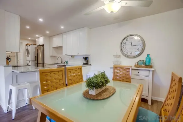 a kitchen with a table and chairs in it