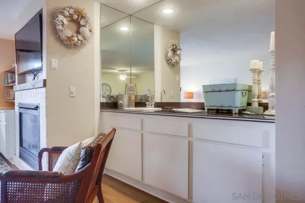 a large kitchen with a table and chairs