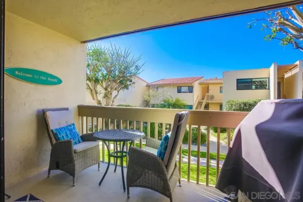 a view of a chairs and table in patio