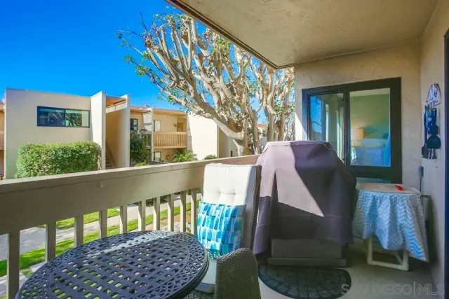 a view of balcony with furniture