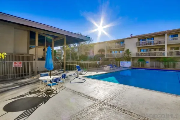 a view of a swimming pool with a lounge chair