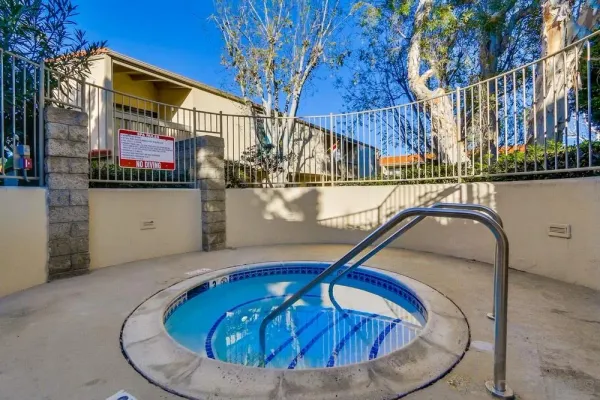 a view of house with swimming pool outdoor seating