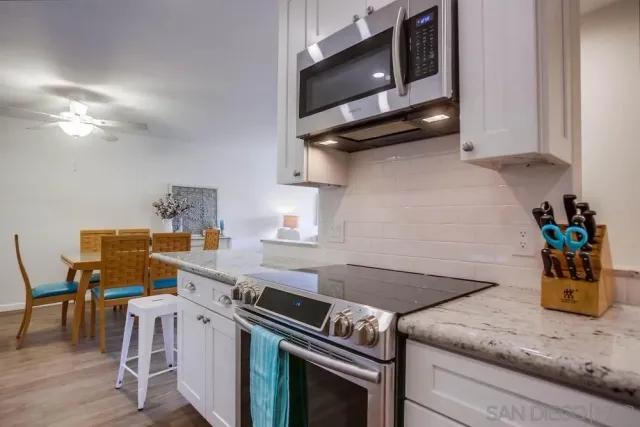 a kitchen with a stove and a microwave