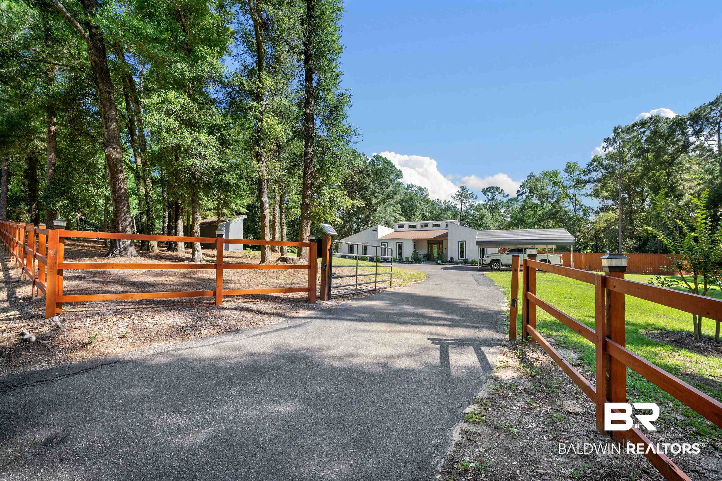 7912 Yorkhaven Road Mobile, AL 36695 - Photo 3 of 41 View of asphalt driveway with a gate and a gated entry