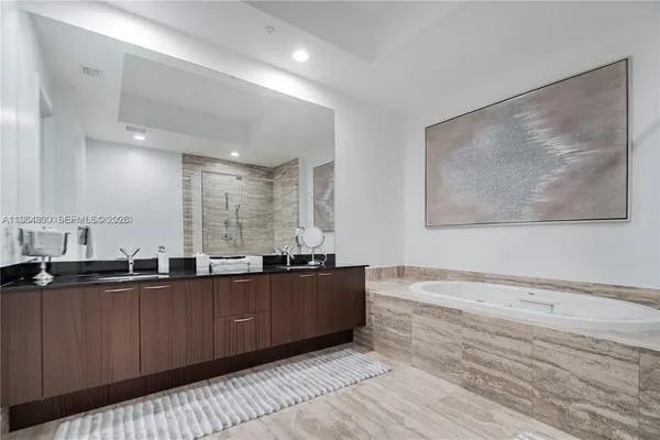 a bathroom with a toilet sink and shower