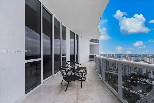 a view of a balcony with chairs